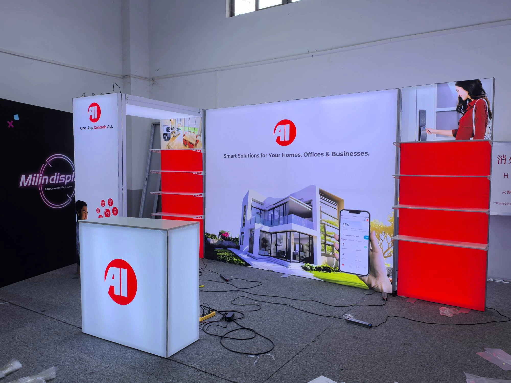 Front view of AI smart home booth with illuminated backdrop and shelves