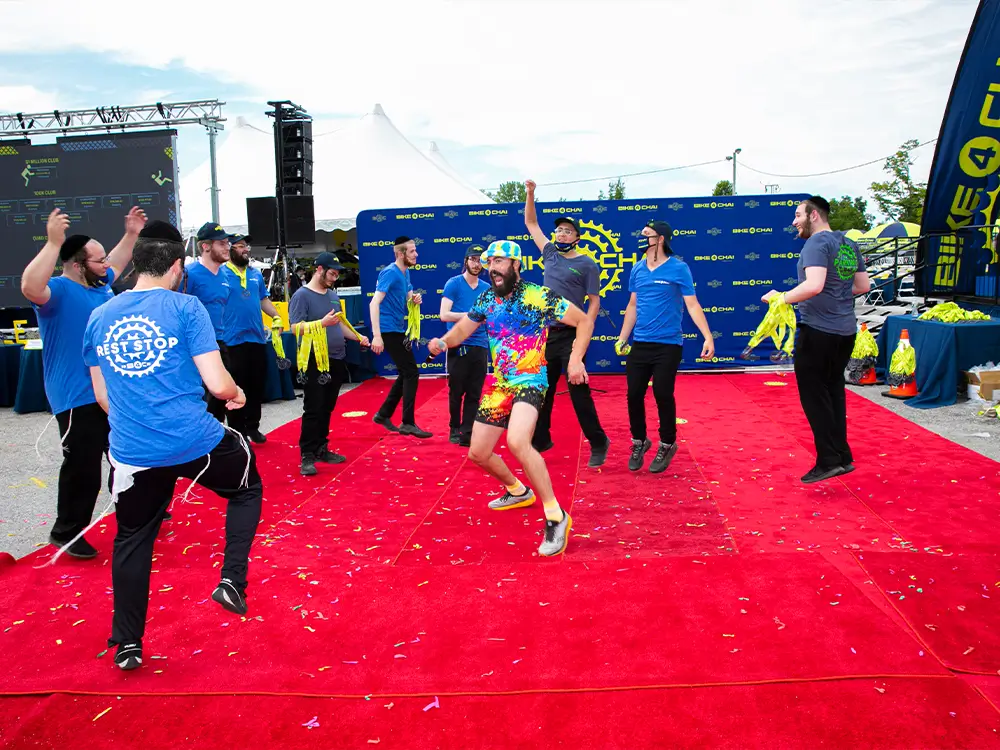 Branded event display structures arranged across an outdoor activation area